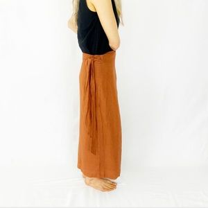 Rust colored size small hand made linen dress I purchased on Etsy. Has pockets:)